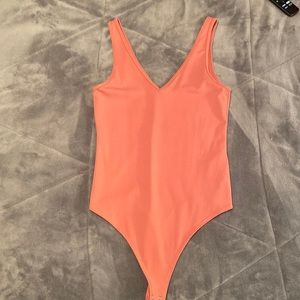 Pink tank top bodysuit